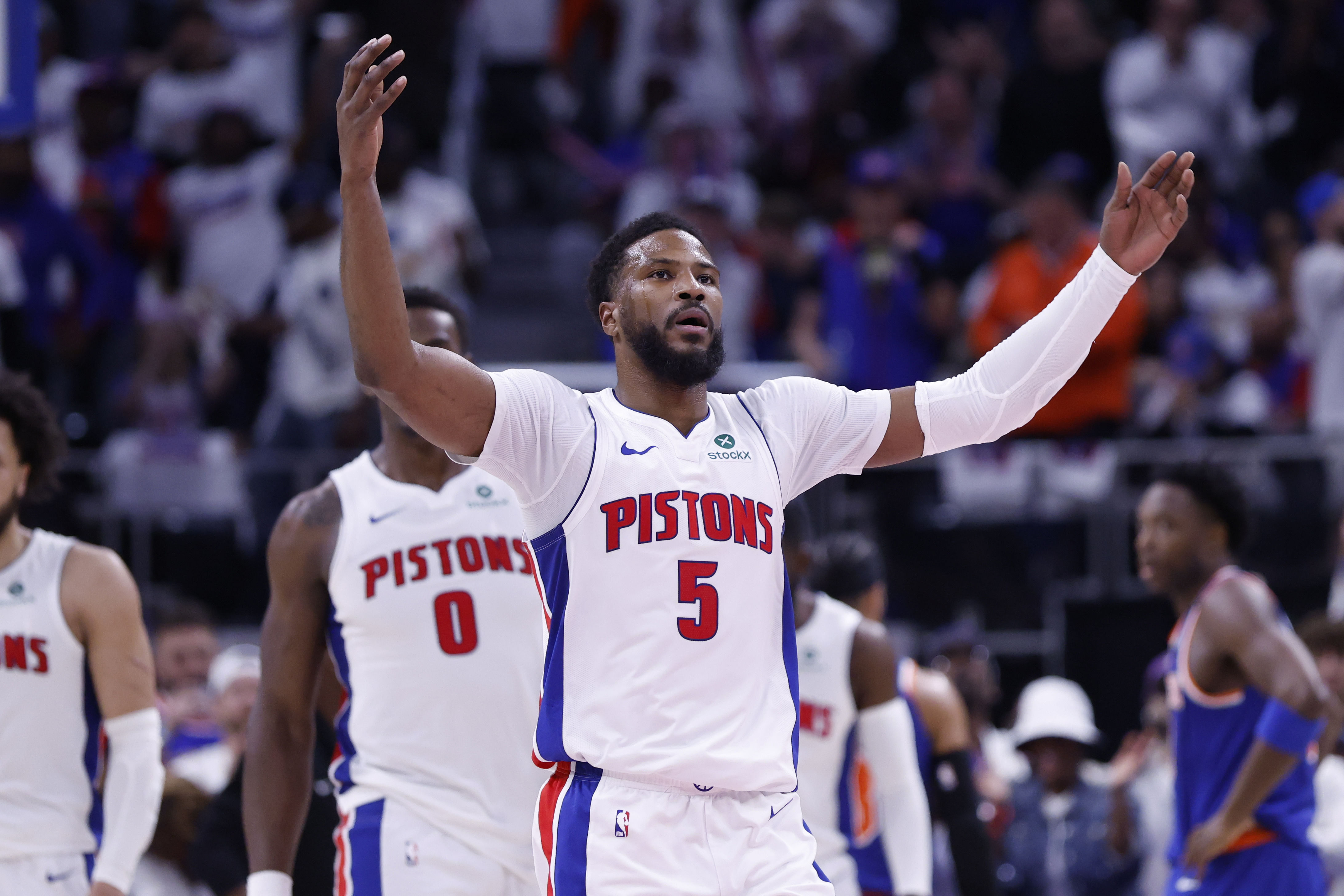 Detroit Pistons guard Malik Beasley (5) fires up the crowd in the first half against the New York Knicks during game six of first round for the 2024 NBA Playoffs at Little Caesars Arena. Mandatory Credit: Rick Osentoski-Imagn Images